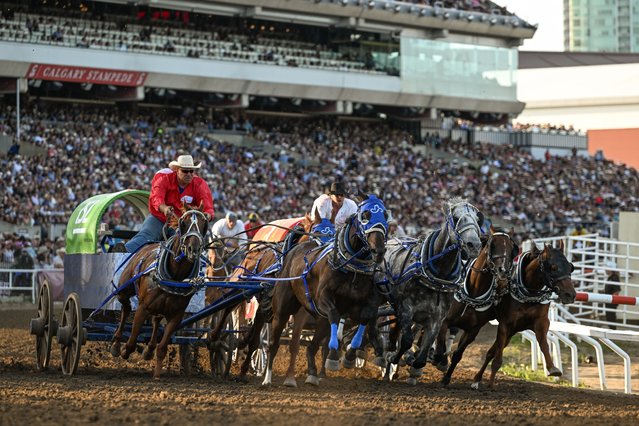 Competitors race during the Rangeland Derby chuckwagon qualifications at the 2025 Calgary Stampede in Calgary, Alberta, Canada, on July 11, 2025.  Often referred to as 'The Greatest Outdoor Show on Earth,' the Calgary Stampede is a massive 10day celebration each July, featuring one of the world's largest rodeos, a lively parade, chuckwagon races, concerts, agricultural exhibitions, and vibrant Indigenous cultural showcases. (Photo by Artur Widak/Anadolu via Getty Images)