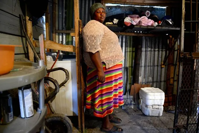 South Africa. Nombini has two Porta Potties, which are used by the 12 people who live in her home. When she first moved to Khayelitsha in 2005, she did not have a toilet so she had to go in the bush, across a main road. “It was terrible in the bush, the cars hit you. When we were given a Porta Potty in 2009, it was much better than going in the bush. Flush toilets are first class compared to the Porta Potty though. My dream is to have a flush toilet”. (Photo by Eric Miller/WSUP/Panos)