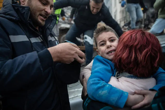 Yigit Cakmak, 8-years-old survivor at the site of a collapsed building, hugs his mother, after workers rescued him 52 hours after the earthquake struck, on February 08, 2023 in Hatay, Turkey. A 7.8-magnitude earthquake hit near Gaziantep, Turkey, in the early hours of Monday, followed by another 7.5-magnitude tremor just after midday. The quakes caused widespread destruction in southern Turkey and northern Syria and were felt in nearby countries. (Photo by Burak Kara/Getty Images)