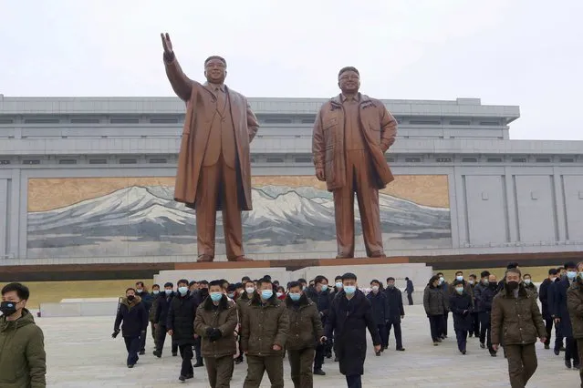 North Koreans visit and pay respect to the statues of  late leaders Kim Il Sung and Kim Jong Il on Mansu Hill in Pyongyang, North Korea Sunday, January 22, 2023 on the occasion of the Lunar New Year. (Photo by Jon Chol Jin/AP Photo)