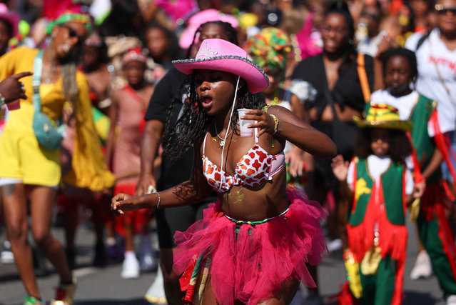 A participant holds a cup during the Children's Day Parade, at Notting Hill Carnival, in London, Britain on August 24, 2025. (Photo by Toby Melville/Reuters)