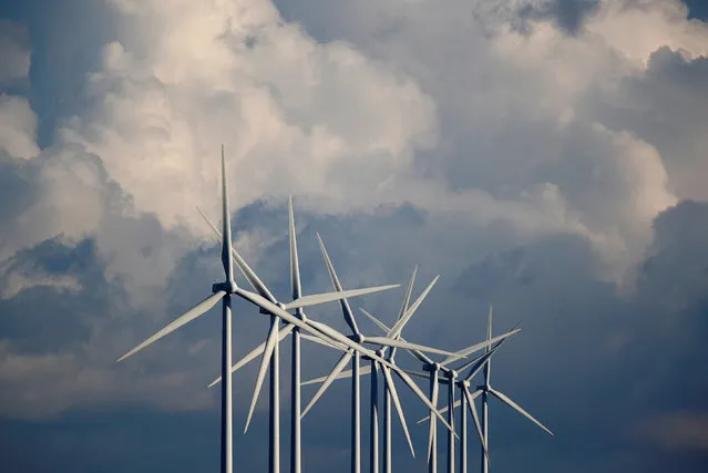 Power-generating wind turbines are seen at a wind park near Greneville-en-Beauce, France, November 30, 2017. (Photo by Christian Hartmann/Reuters)