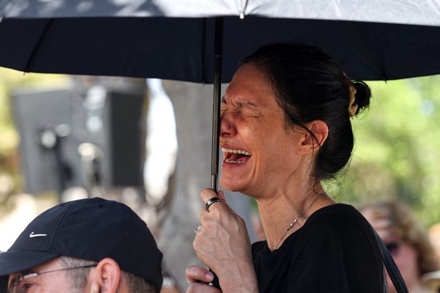 A woman cries during the funeral of Israeli soldier Omer Smadja, 25, killed amid ongoing battles between Israel and the Palestinian militant group Hamas in the Gaza Strip, at a military cemetery in Netanya on June 21, 2024. (Photo by Jack Guez/AFP Photo)