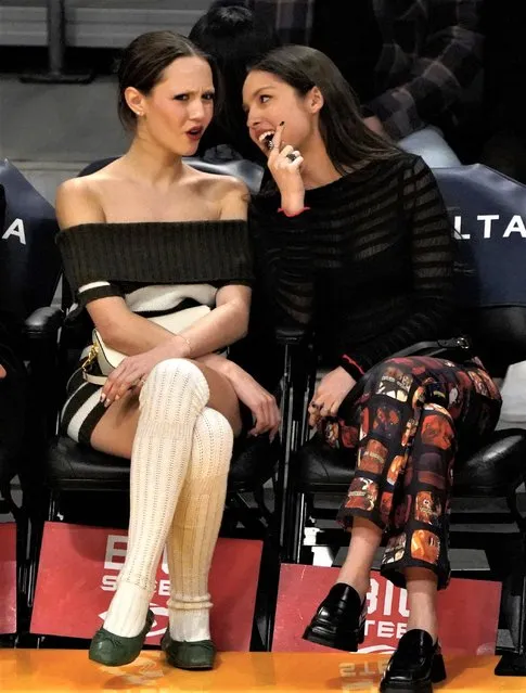 American actress and socialite Iris Apatow (L) and American singer-songwriter Olivia Rodrigo attends the Oklahoma City Thunder and Los Angeles Lakers game at Crypto.com Arena on March 24, 2023 in Los Angeles. (Photo by London Entertainment/Splash News and Pictures)