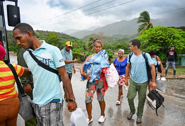 Residents are evacuated from Playa Siboney to safe locations ahead of the arrival of Hurricane Melissa, in Santiago de Cuba, Cuba, on October 28, 2025. (Photo by Yamil Lage/AFP Photo)