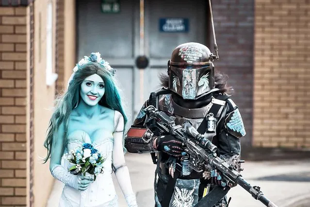 Natalia Williams dressed as Corpse Bride Emily and Tony Knight as a Mandalorian, arrive at the Bradford Unleashed Comic-Con, an entertainment and comic book convention in England on March 8, 2020. (Photo by Danny Lawson/PA Images via Getty Images)