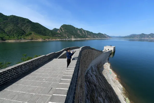 Aerial view of the underwater Great Wall located in the Panjiakou reservoir on May 8, 2023 in Chengde, Hebei Province of China. The underwater Great Wall belongs to the Panjiakou castle which was an important military pass in Ming dynasty (1368-1644). After the Panjiakou reservoir was built in 1975, some part of the Great Wall was submerged. (Photo by Zhai Yujia/China News Service/VCG via Getty Images)