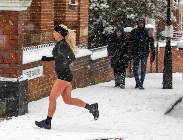 A jogger with chilly legs seen in Highgate Village on January 24, 2021 in London, United Kingdom. Parts of the country saw snow and icy conditions as arctic air caused temperatures to drop. (Photo by Gavin Rodgers/Pixel8000)