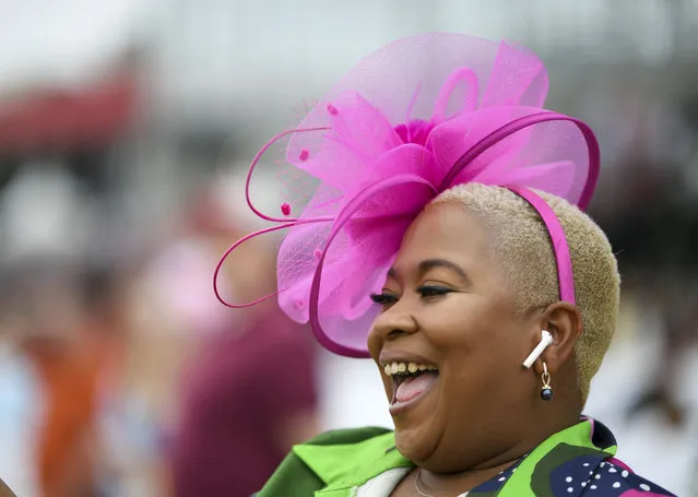 Vennita Paris of Baltimore cheers the horses running in the 3rd race during the 148th running of the Preakness Stakes at Pimlico Race Course on May 20, 2023. (Photo by Jonathan Newton/The Washington Post)