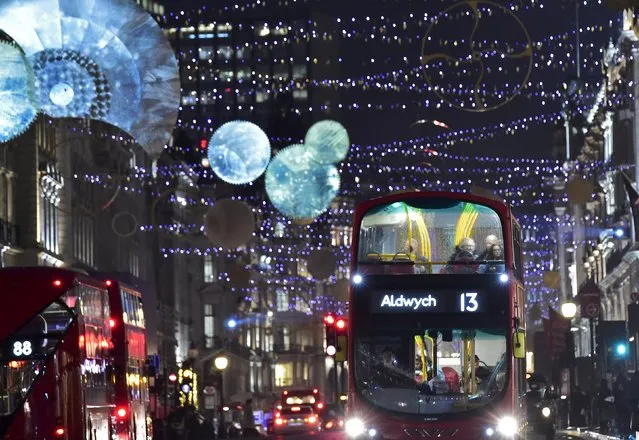 Bus passengers view the Christmas lights display along Regent Street in central London in Britain December 15, 2015. (Photo by Toby Melville/Reuters)