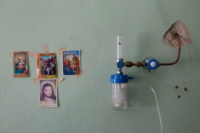 Religious images hang on the wall inside the coronavirus disease (COVID-19) ward of a hospital in Yaremche in Ivano-Frankivsk Region, Ukraine on March 3, 2021. (Photo by Anastasia Vlasova/Reuters)