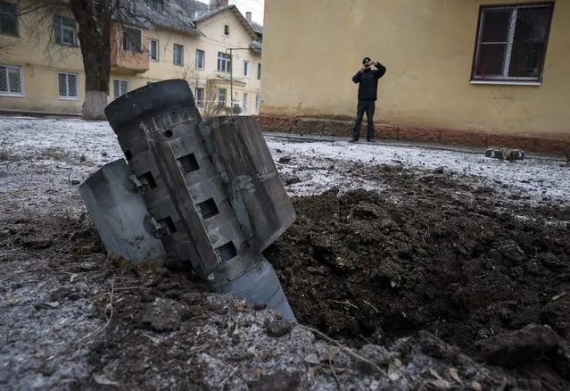 The remains of a rocket shell is seen on a street in the town of Kramatorsk, eastern Ukraine February 10, 2015. (Photo by Gleb Garanich/Reuters)