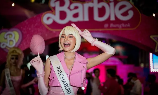 Miss Ratchaburi poses with cotton candy at the “Barbie” premiere in Bangkok, Thailand on July 19, 2023. People attend the pink carpet world premiere of “Barbie” movie by Warner Bros. (Photo by Matt Hunt/Anadolu Agency via Getty Images)
