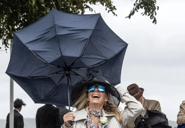 Spectators at Goodwood racecourse had to battle the wind and rain on August 02, 2023 in Chichester, England. (Photo by Richard Pohle/The Times)