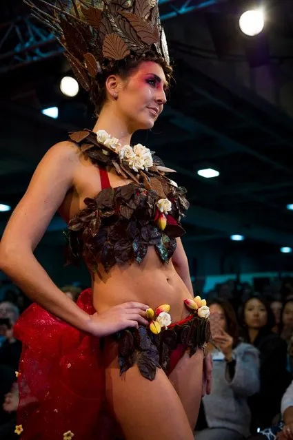 London, United Kingdom. 18th October 2013. A model showcases a chocolate dress at the London Chocolat Fashion show 2013.  Salon du Chocolat, the world's largest chocolate show comes to London. This spectacular finish to a wonderful line up of Chocolate Week activities takes place from 18th-20th October at National Hall, Olympia. (Photo by Anastasia Mishchenko/Demotix Photojournalist)