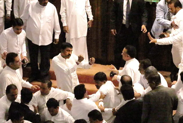 Government and opposition members confront each other during the Parliamentary session in Colombo, Sri Lanka, 15 November 2018. Sri Lanka's legislature met amidst rising accusations of the Speaker being biased towards the ousted Prime Minister Ranil Wickremesinghe and his United National Party (UNP). Prime Minister Mahinda Rajapaksa made a special statement explaining the current situation and suggested a general election. Following his statement, the UNP proposed that the opposition had no confidence in the Premier and his statement and called for a vote to which the Speaker agreed, thus throwing the House into an uproar and resulting in the Speaker walking out. (Photo by M.A. Pushpa Kumara/EPA/EFE)