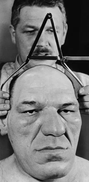 Dr. Carleton Coon measures Maurice Tillet's head with calipers,  February 23, 1940. “A pretty good egg...the nearest thing to what we suppose the Neanderthal man to have been”, stated Coon, a Harvard University anthropologist. (Photo by AP Photo)