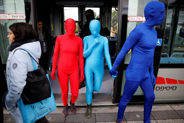 Members of the Prizma Ensemble wearing full solid-coloured bodysuits take part in a festival for the Jewish holiday of Hanukkah, in Jerusalem December 26, 2016. (Photo by Amir Cohen/Reuters)