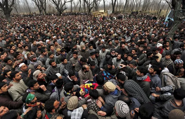 Mourners carry the body of Raqib Bashir, a suspected militant, during his funeral in Zadura village, south of Srinagar, February 7, 2016. The Hizb-ul-Mujahideen militant was killed in a gunbattle with Indian security forces on Saturday in south Kashmir's Pulwama district, local media reported. (Photo by Danish Ismail/Reuters)