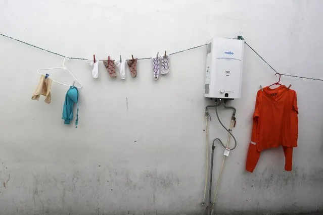 Clothes of female inmates hang against a wall inside in the Topo Chico prison, during a media tour, in Monterrey, Mexico, February 17, 2016. (Photo by Daniel Becerril/Reuters)
