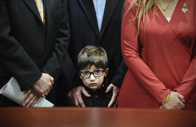 Hayden Lewis, of Norwalk, Conn., cousin of Sandy Hook School shooting victim Jesse Lewis, stands with family during a news conference at the Legislative Office Building, Monday, April 13, 2015, in Hartford, Conn. (Photo by Jessica Hill/AP Photo)
