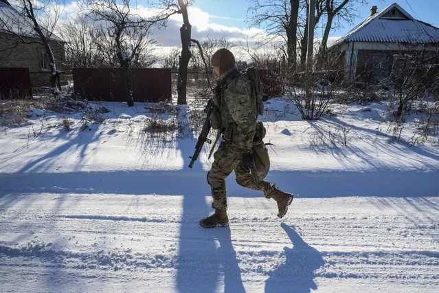 A Ukrainian service member of 79th brigade walks at a street, amid Russia's attack on Ukraine, in Donetsk region, Ukraine on January 12, 2024. (Photo by Oleksandr Ratushniak/Reuters)