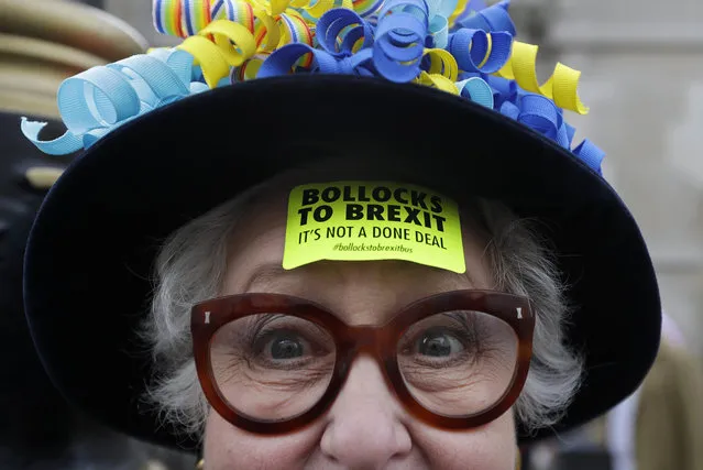 A demonstrator wears a sticker on her forehead during a Peoples Vote anti-Brexit march in London, Saturday, March 23, 2019. (Photo by Kirsty Wigglesworth/AP Photo)