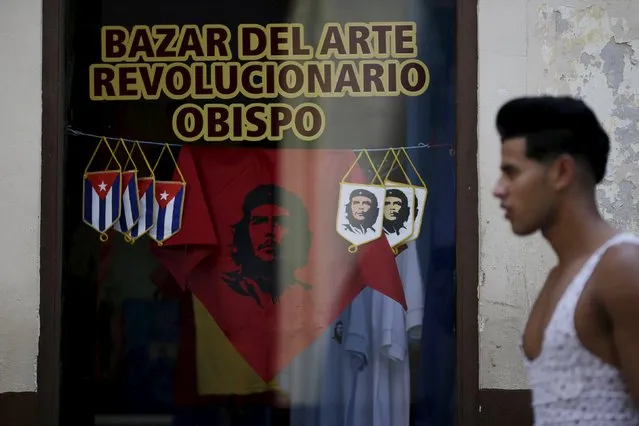 A man walks pass a shop with souvenirs of revolutionary hero Ernesto “Che” Guevara in downtown Havana, March 16, 2016. (Photo by Ueslei Marcelino/Reuters)