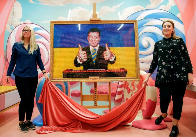 Sweet Museum staff presents a portrait of Ukrainian presidential candidate and comedian Volodymyr Zelenskiy made of candies ahead of the second round of a presidential election, in Saint Petersburg, Russia April 18, 2019. (Photo by Anton Vaganov/Reuters)
