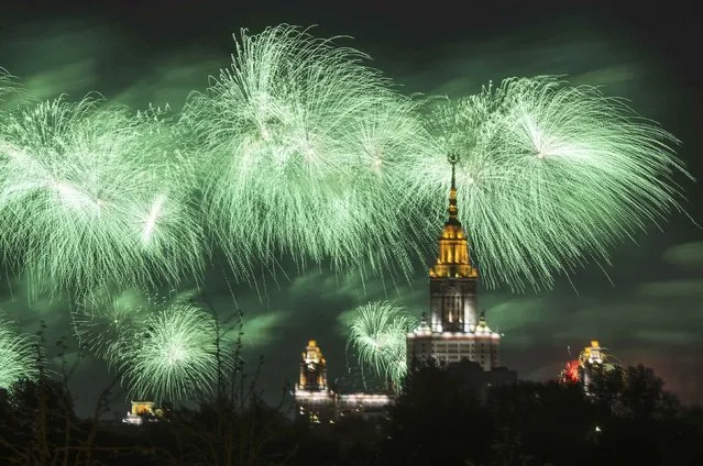 Fireworks explode over the Moscow State University during the Victory Day celebrations in Moscow, Russia, May 9, 2015. (Photo by Reuters/Host Photo Agency/RIA Novosti)