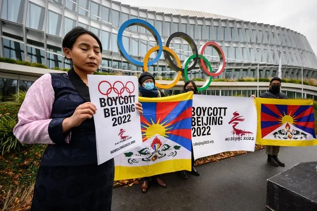 Tibetan activists protest in front of the International Olympic Committee (IOC) headquarters ahead of the February's Beijing 2022 Winter Olympics, on November 26, 2021 in Lausanne. Human rights campaigners and exiles accuses Beijing of religious repression and massively curtailing rights in Tibet. (Photo by Fabrice Coffrini/AFP Photo)