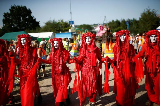 Protestors affiliated with Extinction Rebellion take part in a procession during Glastonbury Festival at Worthy farm in Somerset, Britain on June 27, 2019. (Photo by Henry Nicholls/Reuters)