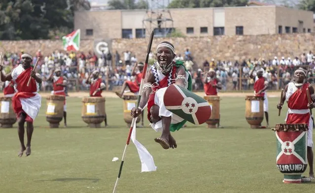 Tribal dancers entertain Burundians in Bujumbura, Burundi, Wednesday July 1, 2015. Burundi celebrated its 53rd  Independence Day on Wednesday, as the country awaits results of parliamentary elections marked by an opposition boycott and the threat of violence in the capital. (Photo by Berthier Mugiraneza/AP Photo).