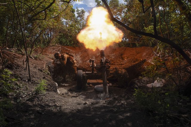 Servicemen of Ukraine's 93rd Mechanised Brigade fire a French MO-120-RT heavy mortar at the Russian forces on the front line near the city of Bakhmut in Ukraine's Donetsk region on Wednesday, May 22, 2024. (Photo by Iryna Rybakova via AP Photo)