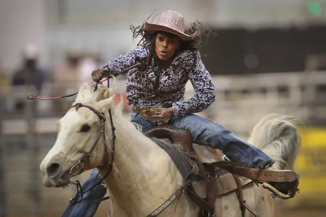 A cowgirl participates in the barrel race competition at the Bill Pickett Invitational Rodeo on April 1, 2017 in Memphis, Tennessee. (Photo by Scott Olson/Getty Images)