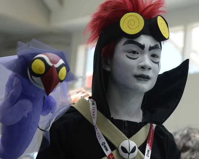 A costumed attendee on the third day of Comic Con International in San Diego, California, July 11, 2015. (Photo by Robyn Beck/AFP Photo)