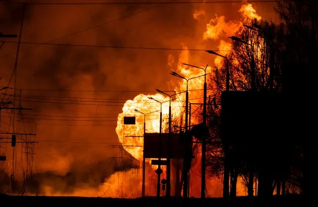 A gas station burns after Russian attacks in the city of Kharkiv, on March 30, 2022, amid Russian invasion of Ukraine. (Photo by Fadel Senna/AFP Photo)