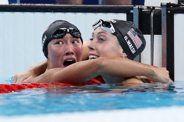 Torri Huske and Gretchen Walsh of Team United States celebrate after winning gold and silver in the Women’s 100m Butterfly Final on day two of the Olympic Games Paris 2024 at Paris La Defense Arena on July 28, 2024 in Nanterre, France. (Photo by Quinn Rooney/Getty Images)