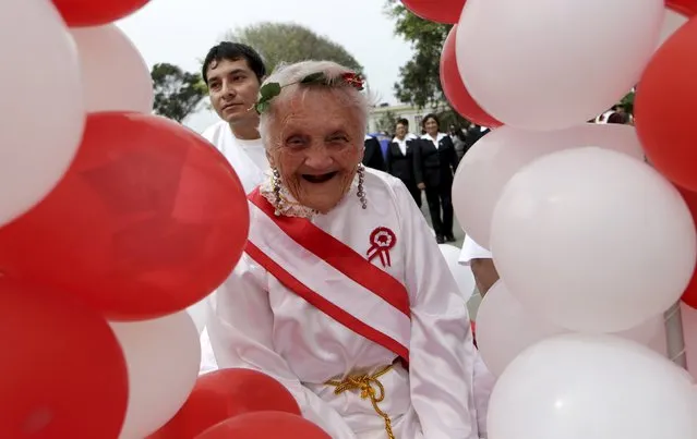 A patient wearing a costume representing the Motherland parades during Independence Day celebrations, at the Larco Herrera psychiatric hospital in Lima July 22, 2015. The hospital, founded in 1917 and the biggest of its kind in Peru, currently houses more than 450 patients. Peru will celebrate its Independence Day on July 28. (Photo by Mariana Bazo/Reuters)