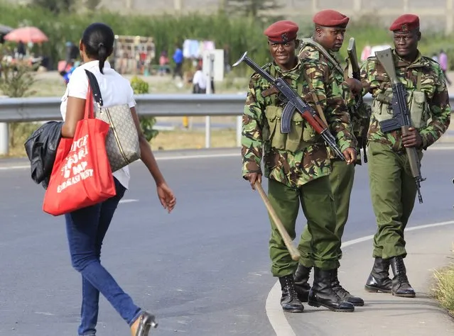 Members of the General Service Unit (GSU) policemen patrol a section of an over-pass where U.S. President Barack Obama will be driving through during his arrival for his three-day state visit, in Kenya's capital Nairobi July 24, 2015. Obama departed for Kenya on Thursday, his first trip to his father's homeland as U.S. president, kicking off a swing through Africa that will also include a stop in Ethiopia. (Photo by Noor Khamis/Reuters)