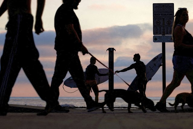 People gather at the beach as Southern California faces an excessive heat warning for the remainder of the week in Oceanside, California on September 4, 2024. (Photo by Mike Blake/Reuters)