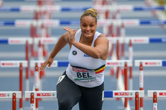 Belgian shot putter Jolien Boumkwo competes in the 100-meter hurdles during the European Athletics Team Championships in Chorchow, Silesia, Poland on Saturday, June 24, 2023. Boumkwo finished in last place, 19 seconds behind the next slowest athlete, but she still emerged as an unlikely hero. Injuries had forced her teammates out of the event, and she stepped up to help Belgium avoid relegation from the first division. (Athletes are awarded a point just for taking part in an event). (Photo by Erik van Leeuwen/Belga via AFP Photo)