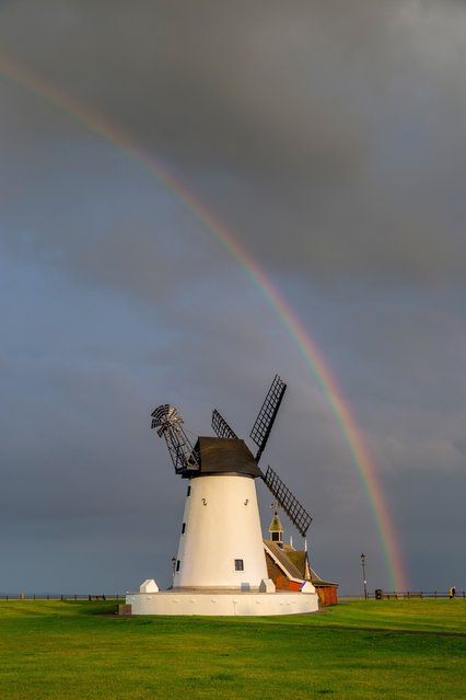 The picture dated May 21, 2024 shows a rainbow over Lytham windmill in Lancashire. An area of low pressure is set to bring heavy rain and thunderstorms to parts of the UK over the next few days, according to the Met Office. (Photo by John Threlfall/Bav Media)