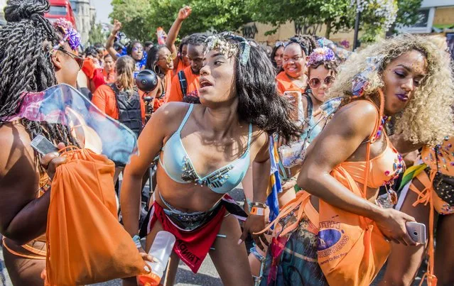 Dancers in costume dance behind their float at Notting Hill Carnival on August 28, 2017 in London, England. (Photo by Guy Bell/Rex Features/Shutterstock)