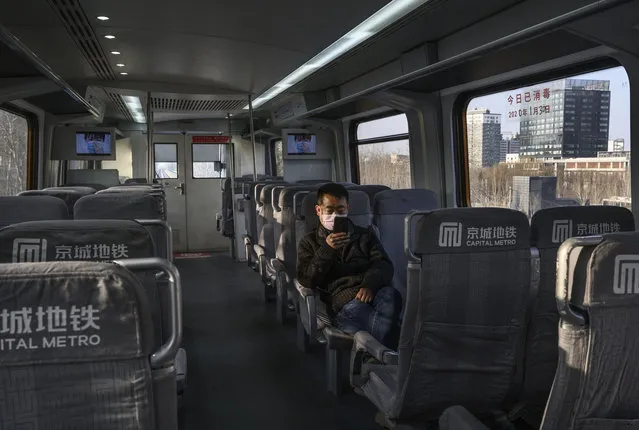 A man sits alone on the metro to Beijing Capital Airport on January 30, 2020 in Beijing, China. The number of coronavirus cases rose to over 7000 in mainland China as the city of Wuhan is still under lock-down in an effort to contain the spread of the pneumonia-like disease which experts have confirmed can be passed from human to human. Chinese authorities have put travel restrictions on the city which is the epicenter of the virus and neighboring municipalities affecting tens of millions of people. The number of those who have died from the virus in China climbed to over 170 on Thursday, mostly in the Hubei province. With cases have been reported in other countries including the United States, Canada, Australia, Japan, South Korea, and France, the World Health Organization has warned all governments to be on alert, and its emergency committee is to meet later on Thursday to decide whether to declare a global health emergency. (Photo by Kevin Frayer/Getty Images)