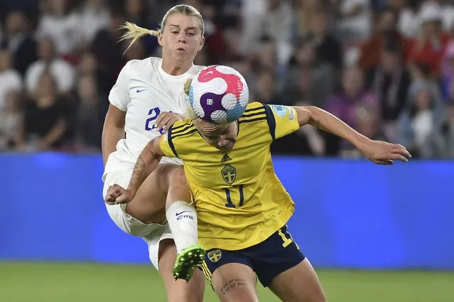 Sweden's Caroline Seger, right, and England's Alessia Russo challenge for the ball during the Women Euro 2022 semi final soccer match between England and Sweden at the Bramall Lane Stadium in Sheffield, England, Tuesday, July 26, 2022. (Photo by Rui Vieira/AP Photo)