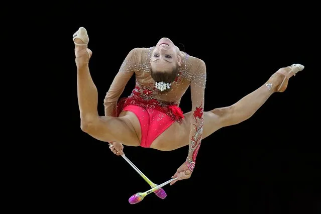 Carmel Kallemaa of Canada performs with the clubs in the Apparatus final of the Rhythmic Gymnastics competition at the Commonwealth Games in Birmingham, England, Saturday, August 6, 2022. (Photo by Kirsty Wigglesworth/AP Photo)