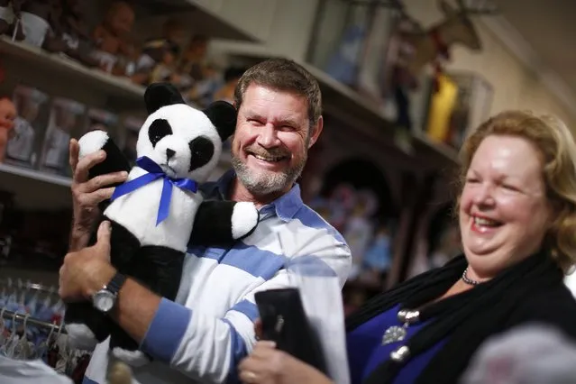 Customers Sue and Allan Paviour are pictured with their teddy bear that had been repaired as they collect it at Sydney's Doll Hospital, May 20, 2014. (Photo by Jason Reed/Reuters)