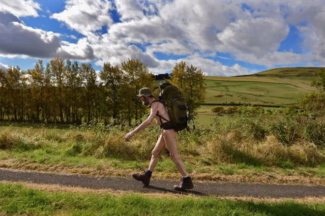 Stephen Gough the naked rambler makes his way south through Peebles in the Scottish Borders, following his release from Saughton Prison yesterday after serving his latest sentence on October 6, 2012 in Peebles, Scotland. The rambler has 18 convictions and has been in prison on and off since 2006 with offences ranging from not wearing clothes in front of the sheriff, breach of the peace and contempt of court.  (Photo by Jeff J. Mitchell)