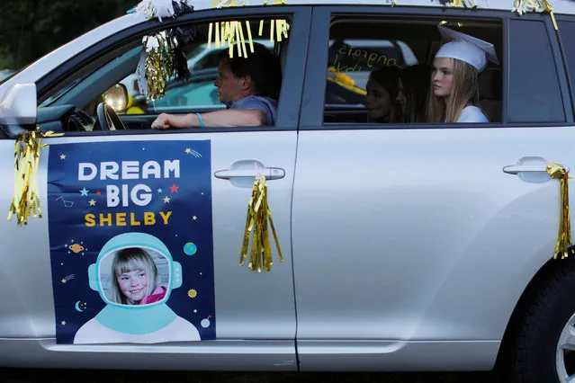 High school senior Shelby Kosterman sits in the back seat of a car during Pioneer Valley Regional School’s graduation, which was held in the Northfield Drive-In Theater because of the coronavirus disease (COVID-19) outbreak, in Hinsdale, New Hampshire, U.S., June 8, 2020. (Photo by Brian Snyder/Reuters)